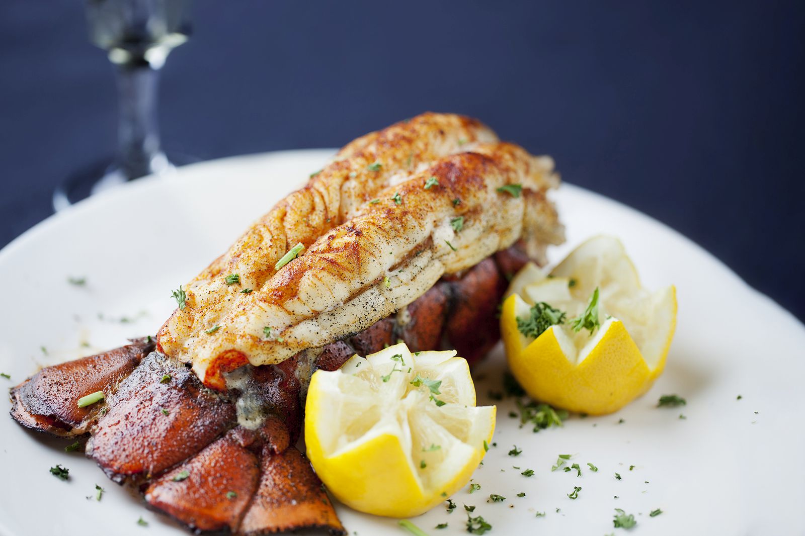 Large lobster tail served with white wine